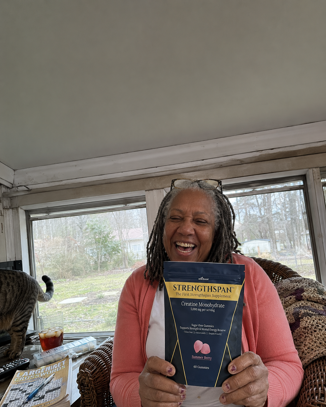 Person holding a Strengthspan bag in a sunroom
