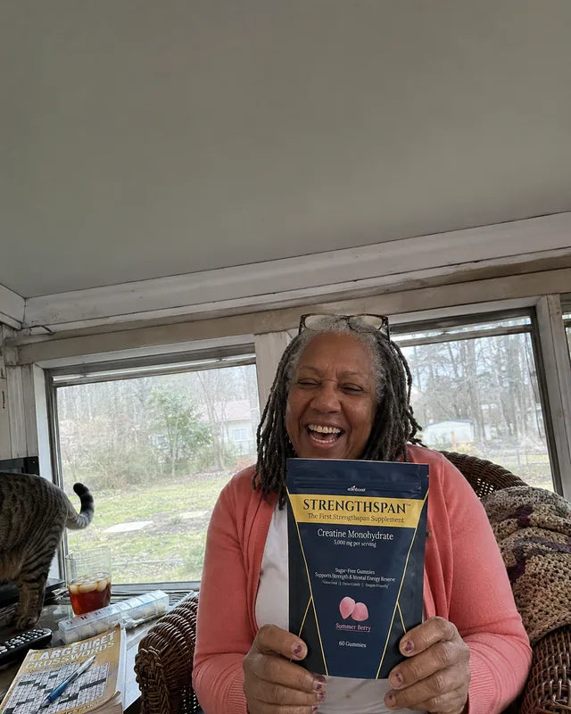 Person holding a Strengthspan bag in a sunroom
